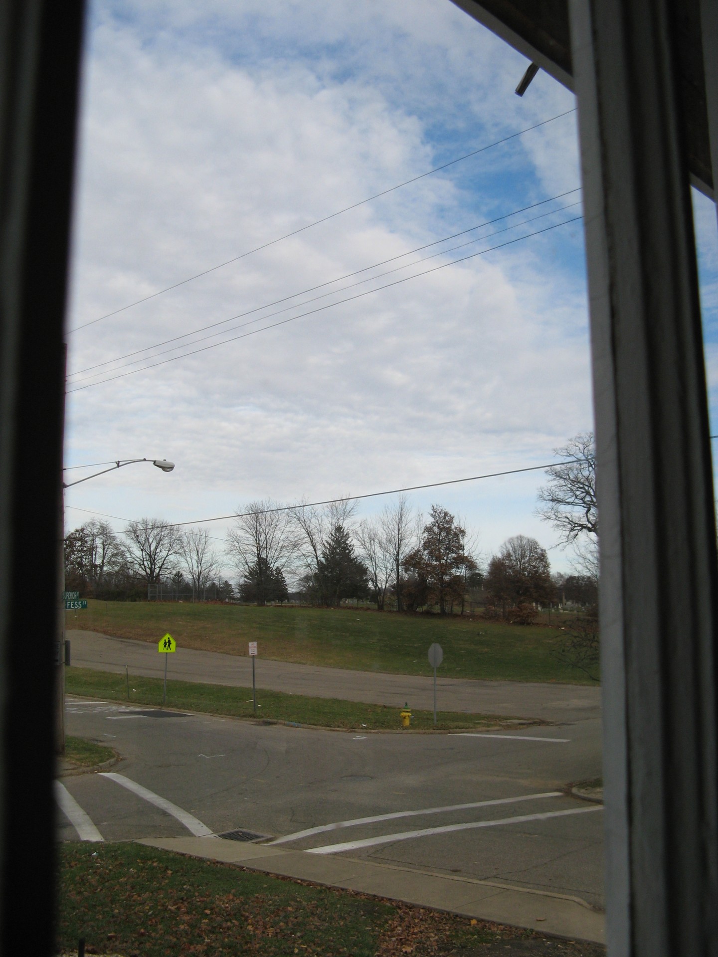 view looking out from the front porch, woodlawn cemetary in the distance.